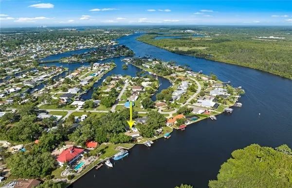 an aerial view of a houses with city view
