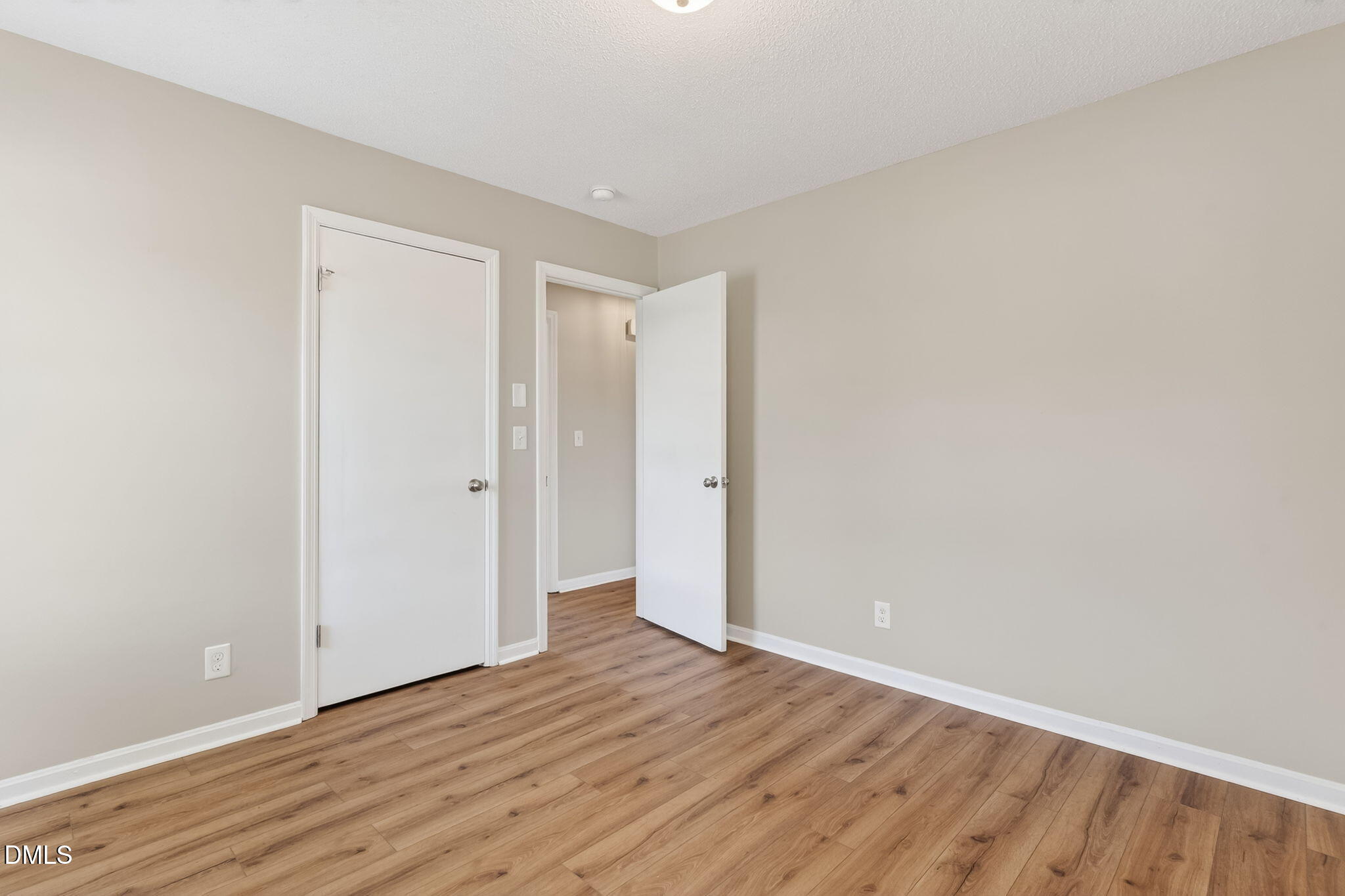 6086 Red Hill Church Road Coats, NC 27521 - Photo 21 of 44 a view of an empty room with wooden floor