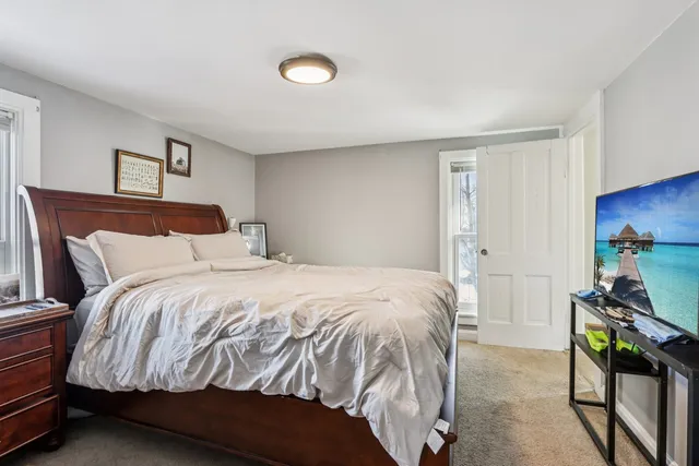 a bedroom with a bed and a dresser