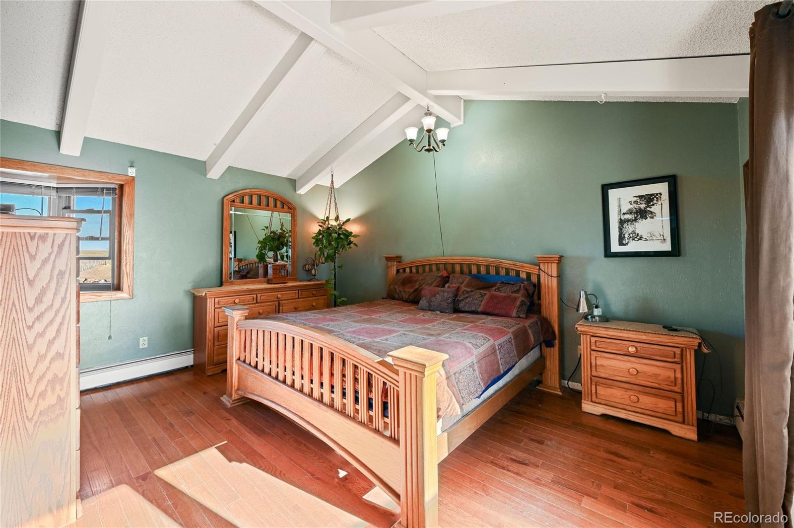 5430 Murr Road Peyton, CO 80831 - Photo 28 of 50 a bedroom with bed and a window
