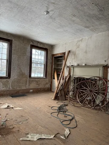 a view of a livingroom with furniture and a fireplace