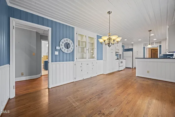 a view of a kitchen with a dishwasher cabinets and wooden floor