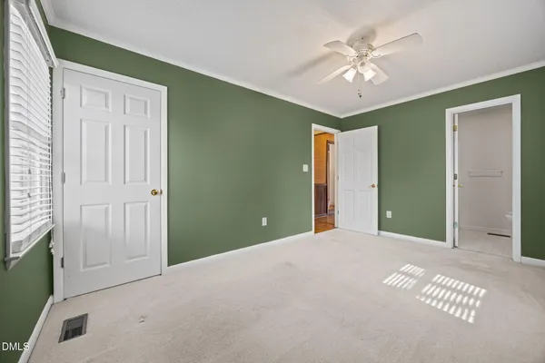 a view of a livingroom with a chandelier fan