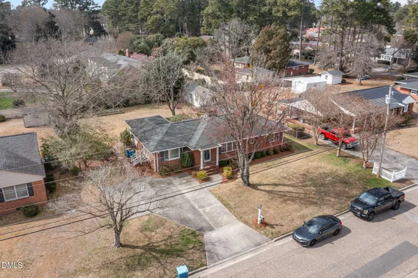 an aerial view of a house with a yard