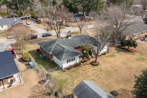 an aerial view of a house with a yard and garage