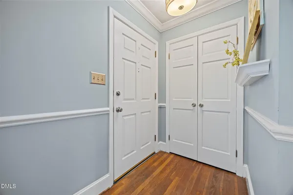 a view of an entryway with wooden floor