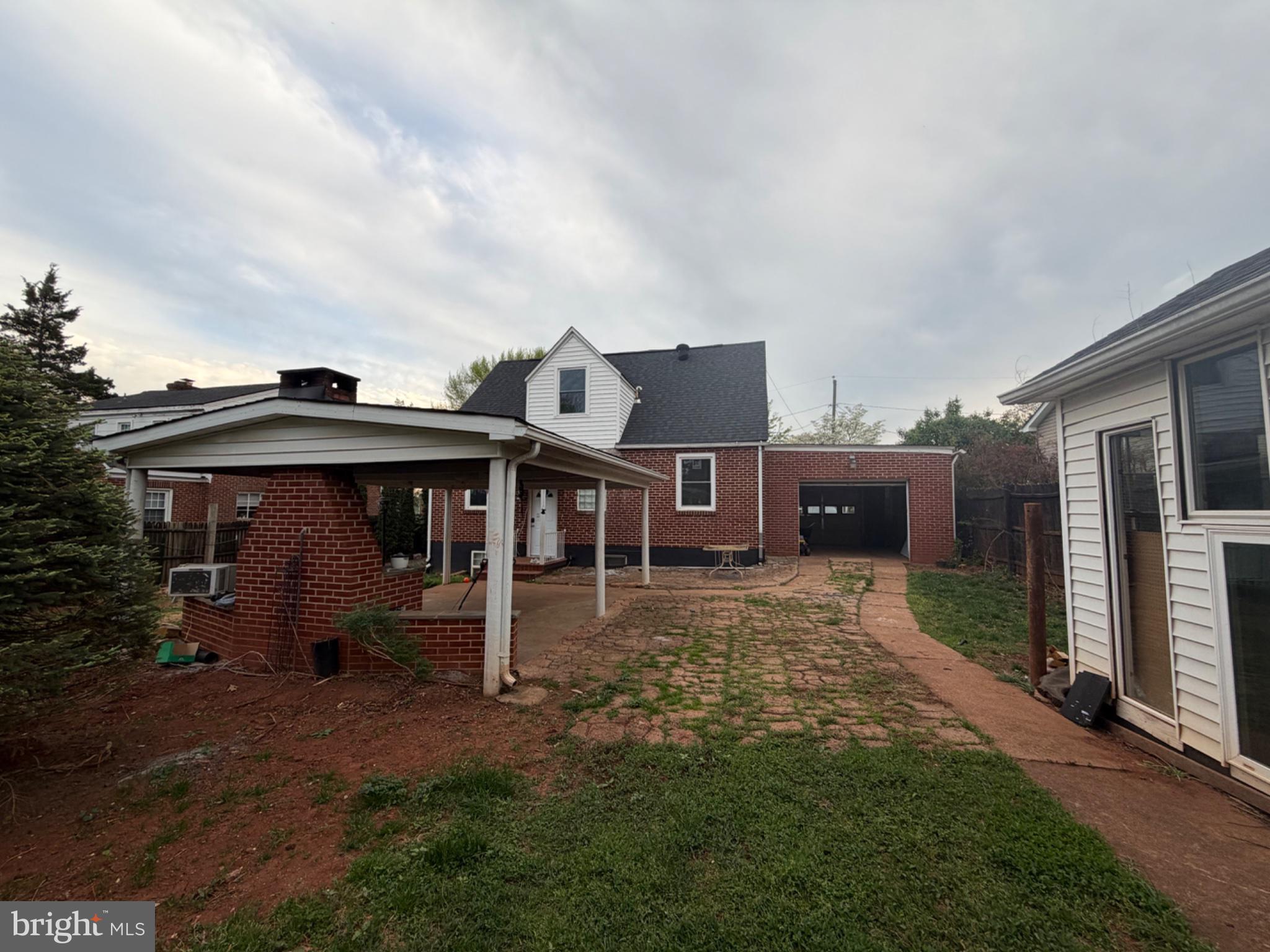 1235 South Blue Ridge Avenue Culpeper, VA 22701 - Photo 4 of 20 Charming backyard with rustic appeal.