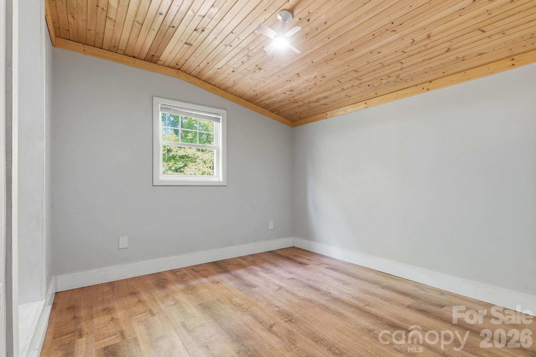 5347 Haney Road York, SC 29745 - Photo 24 of 39 an empty room with wooden floor and windows