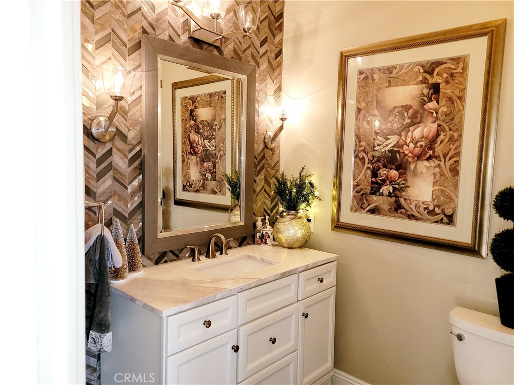14119 Ashton Lane Riverside, CA 92508 - Photo 31 of 47 a bathroom with a sink and a mirror