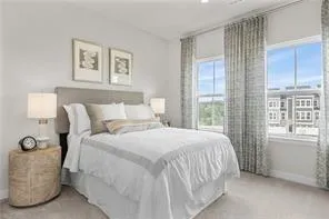 a bedroom with bed and window