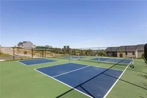 a swimming pool with trees in the background