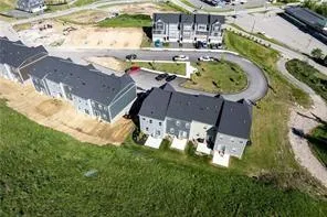 a view of a swimming pool with a yard