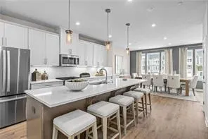 a kitchen with sink cabinets and refrigerator