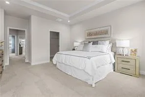 a bedroom with a bed and a lamp
