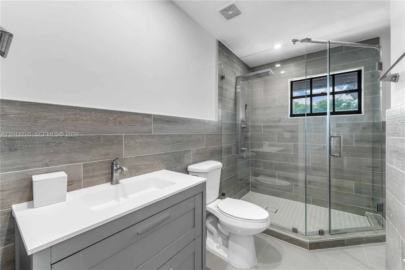 6327 Southwest 127th Place Miami, FL 33183 - Photo 15 of 48 a bathroom with a toilet sink and shower