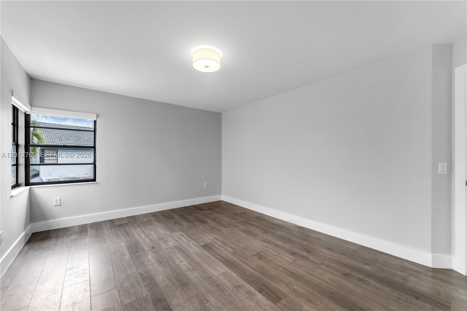 6327 Southwest 127th Place Miami, FL 33183 - Photo 19 of 48 a view of an empty room and window