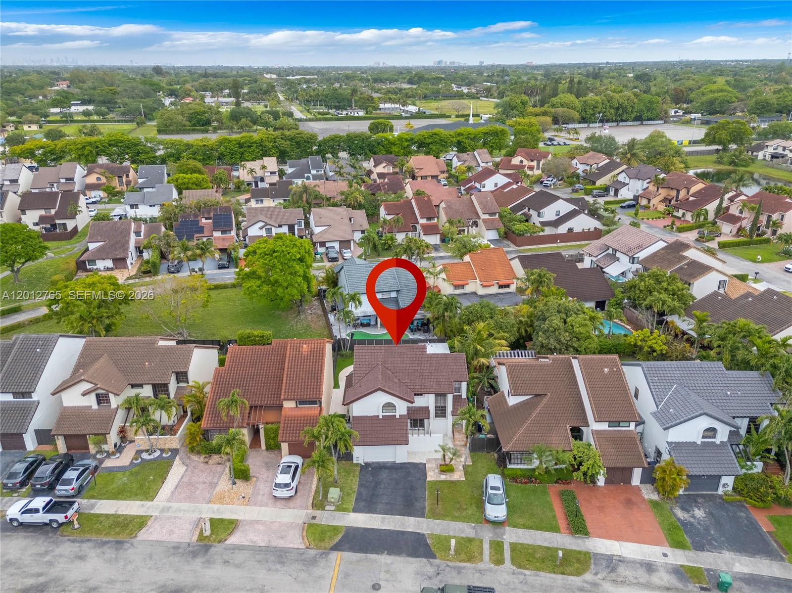 6327 Southwest 127th Place Miami, FL 33183 - Photo 36 of 48 an aerial view of residential houses with outdoor space and parking