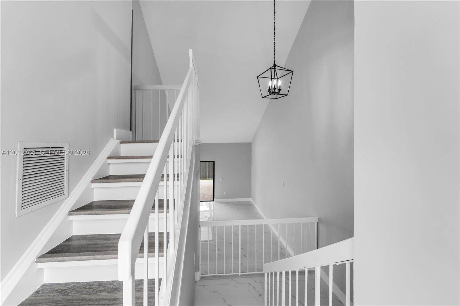 6327 Southwest 127th Place Miami, FL 33183 - Photo 4 of 48 a view of entryway with wooden floor