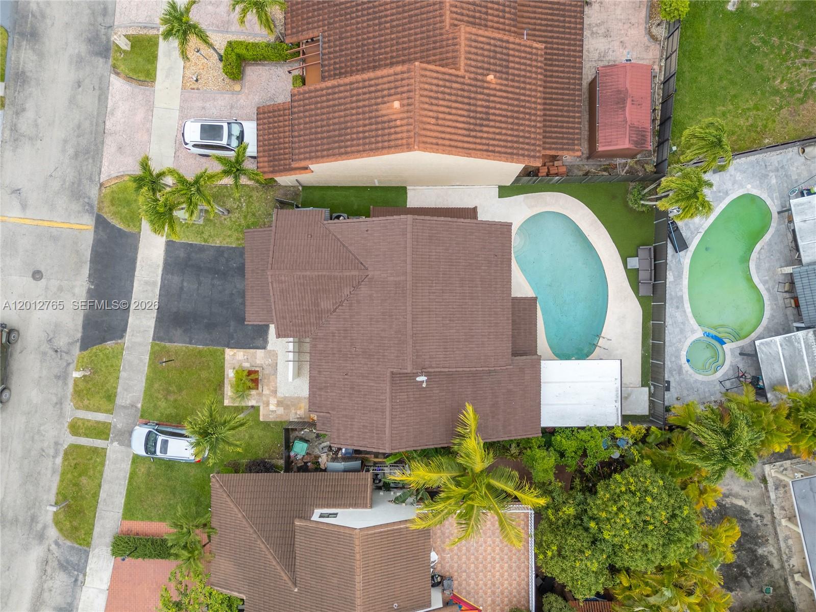 6327 Southwest 127th Place Miami, FL 33183 - Photo 47 of 48 an aerial view of a house with swimming pool and large trees