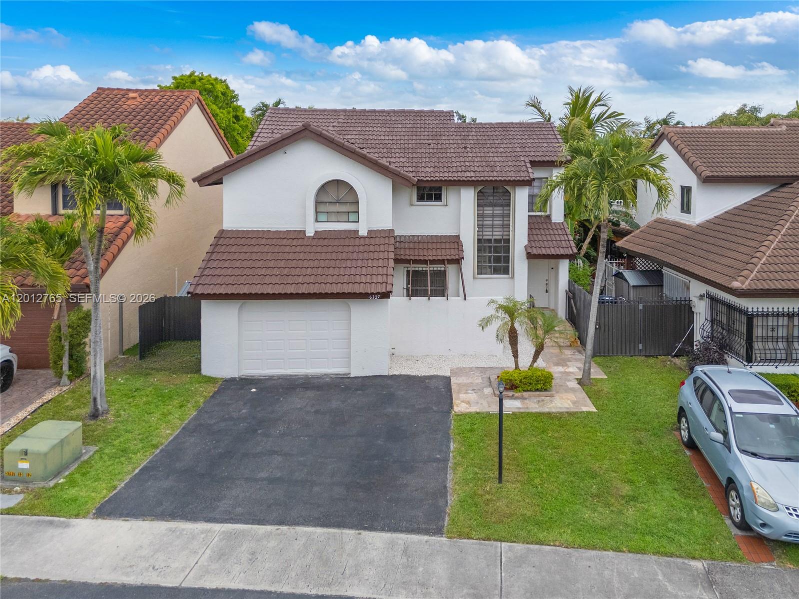 6327 Southwest 127th Place Miami, FL 33183 - Photo 48 of 48 a house view with a garden space