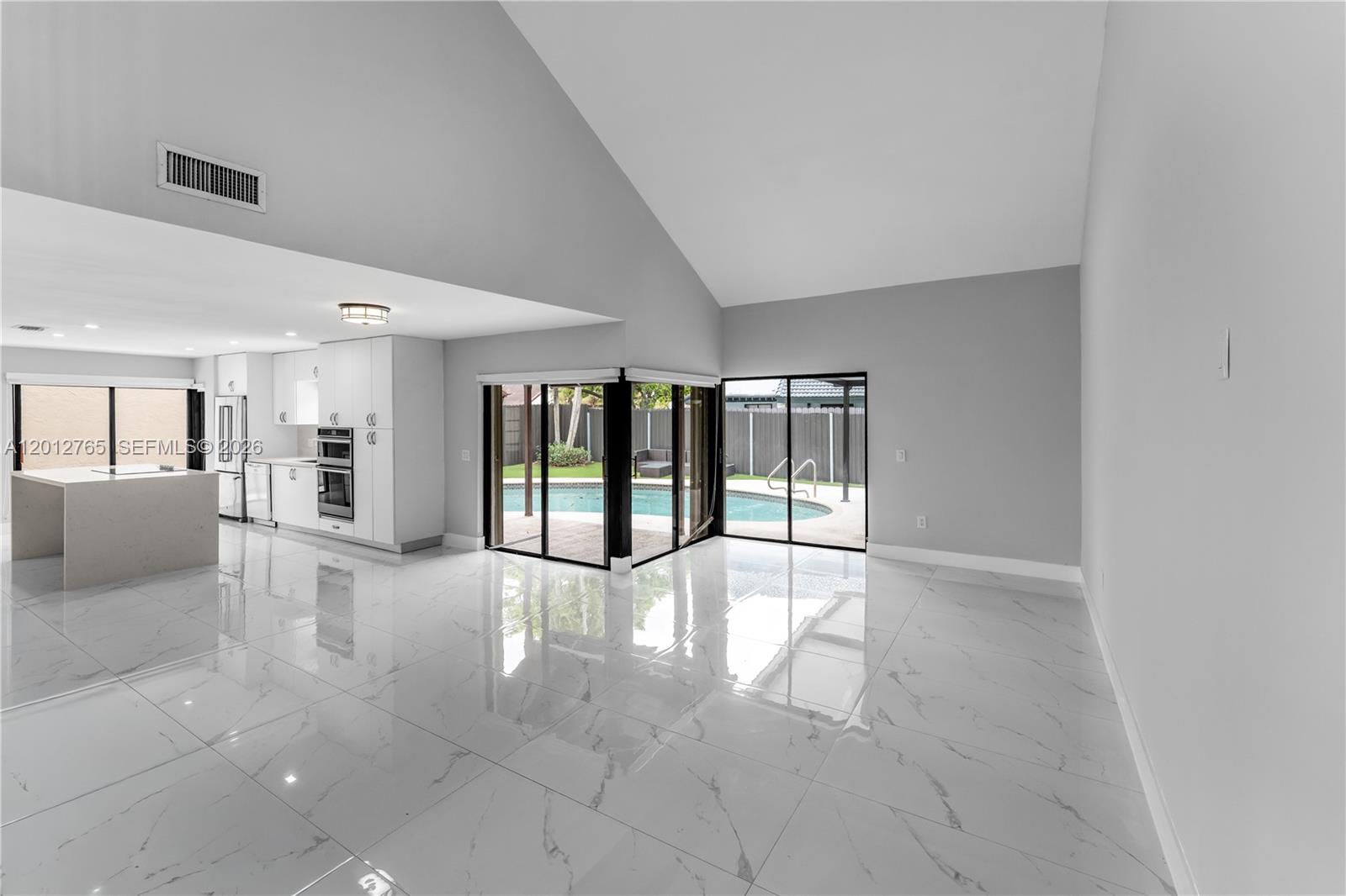 6327 Southwest 127th Place Miami, FL 33183 - Photo 6 of 48 a view of an empty room with a window