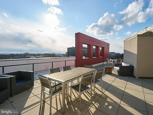 a view of a terrace with furniture and a potted plant