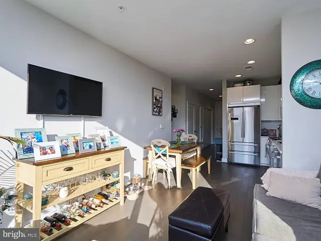 a bedroom with furniture and a flat screen tv