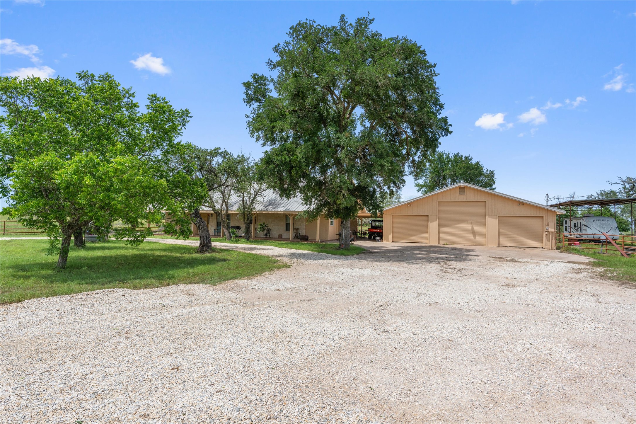 1000 County Road 215 Florence, TX 76527 - Photo 13 of 40 a view of a house with a yard and garage