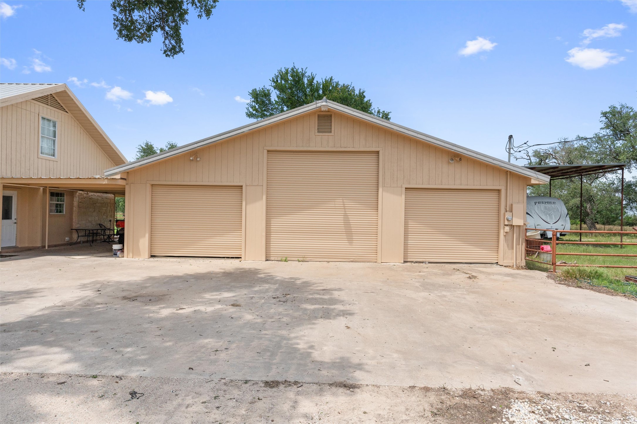 1000 County Road 215 Florence, TX 76527 - Photo 19 of 40 a view of a house with a outdoor space and garage