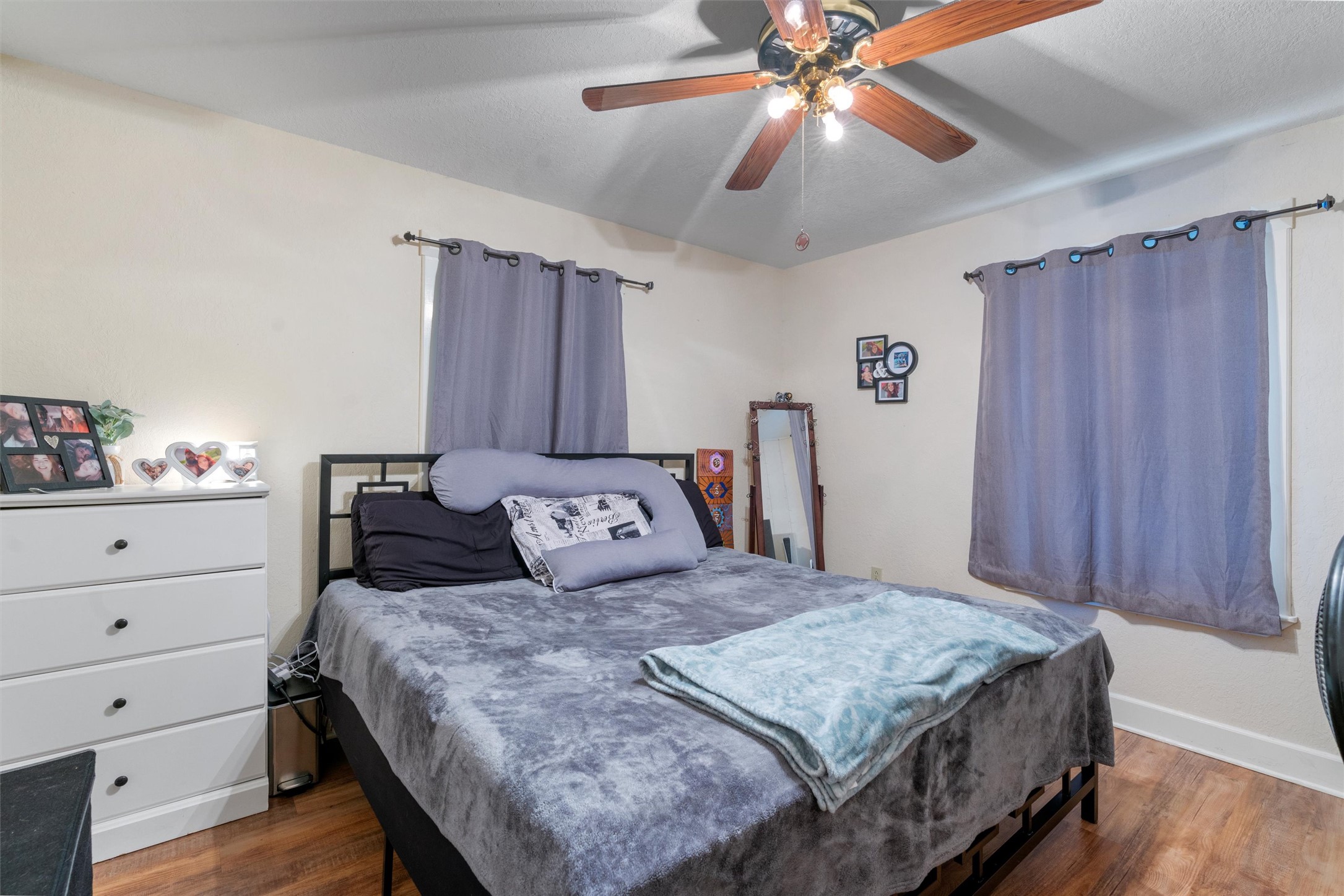 1000 County Road 215 Florence, TX 76527 - Photo 22 of 40 a bedroom with a bed and a chandelier