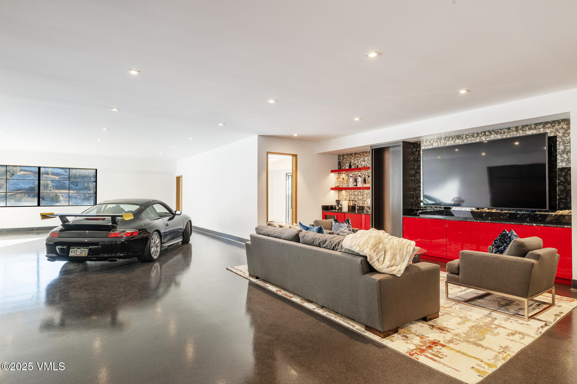 1326 Spraddle Creek Road Vail, CO 81657 - Photo 11 of 26 a living room with furniture and a flat screen tv
