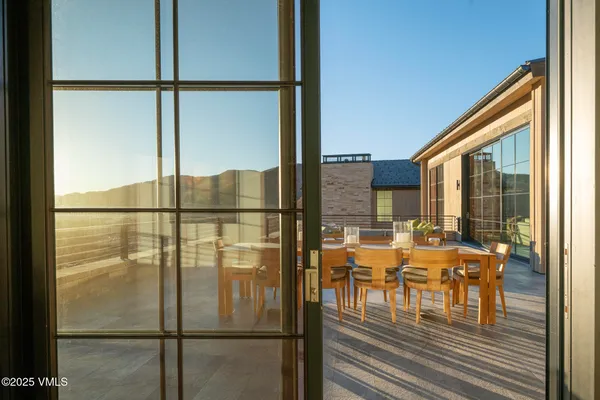 a dining room with furniture window and outside view