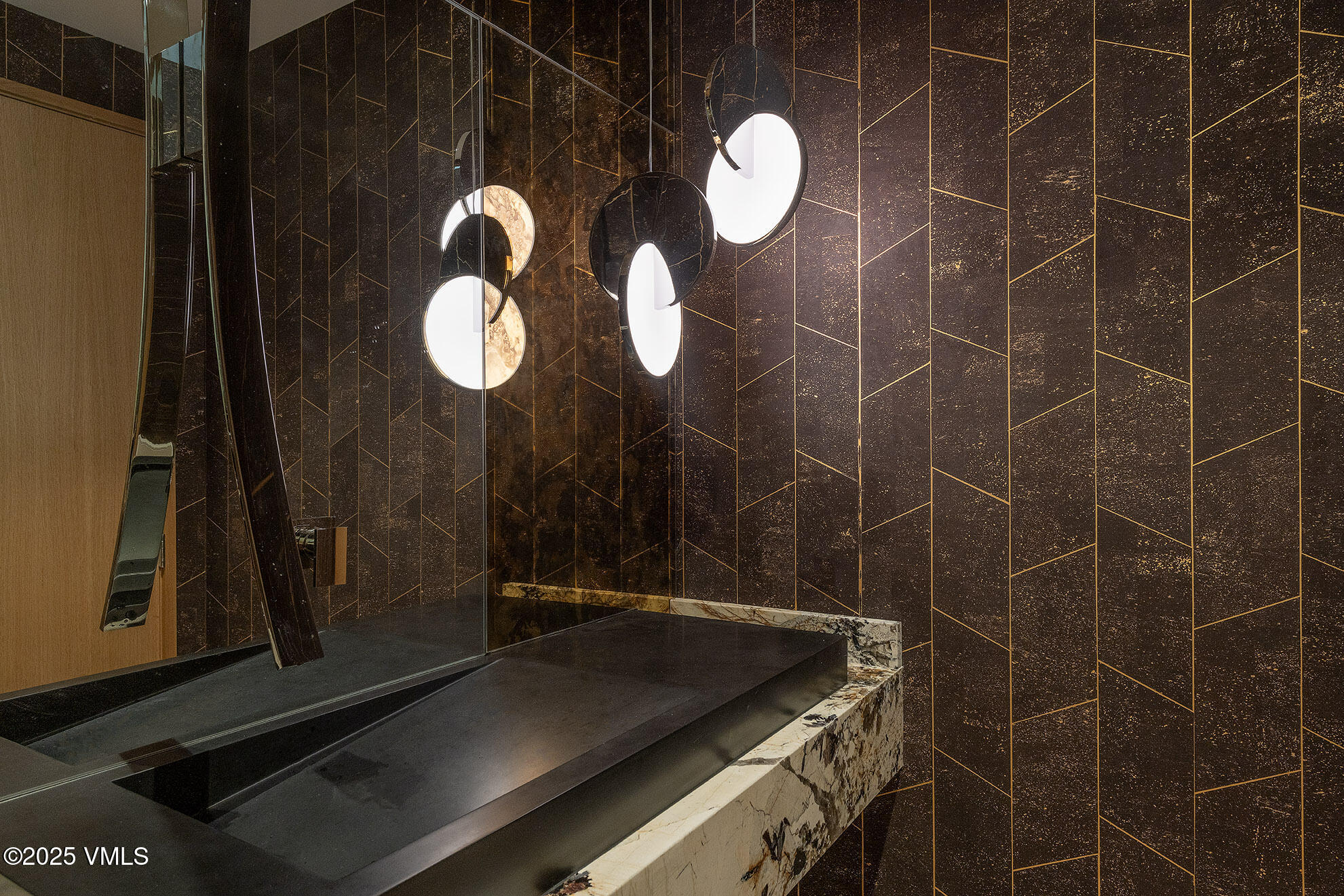 1326 Spraddle Creek Road Vail, CO 81657 - Photo 15 of 26 a bathroom with a sink and a mirror