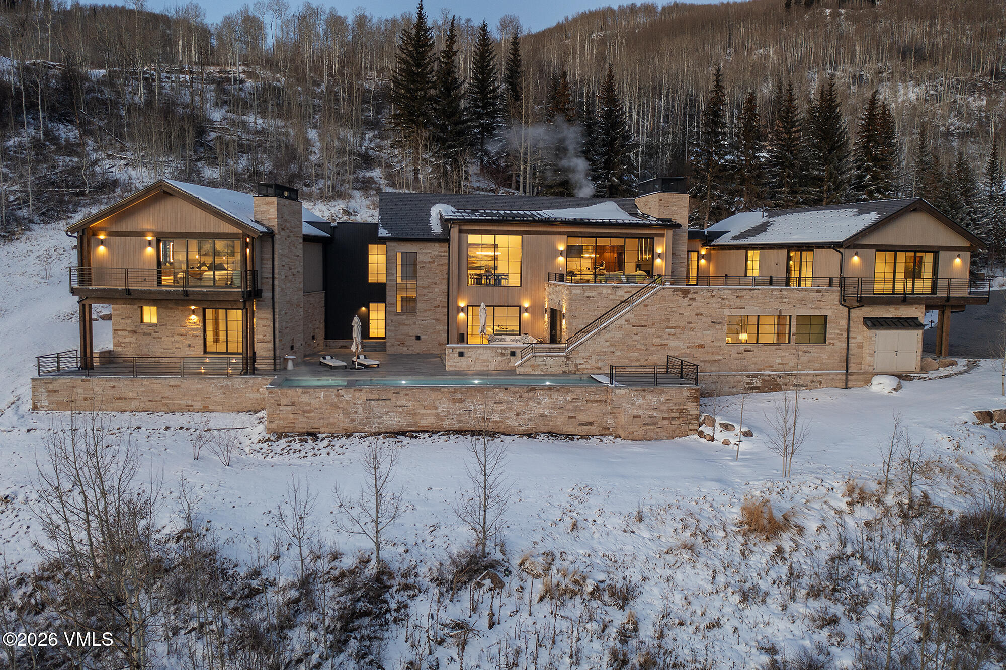 1326 Spraddle Creek Road Vail, CO 81657 - Photo 16 of 26 a front view of a house with a yard