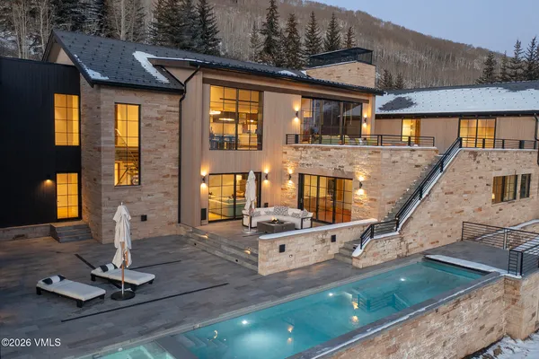 a front view of house with a garden