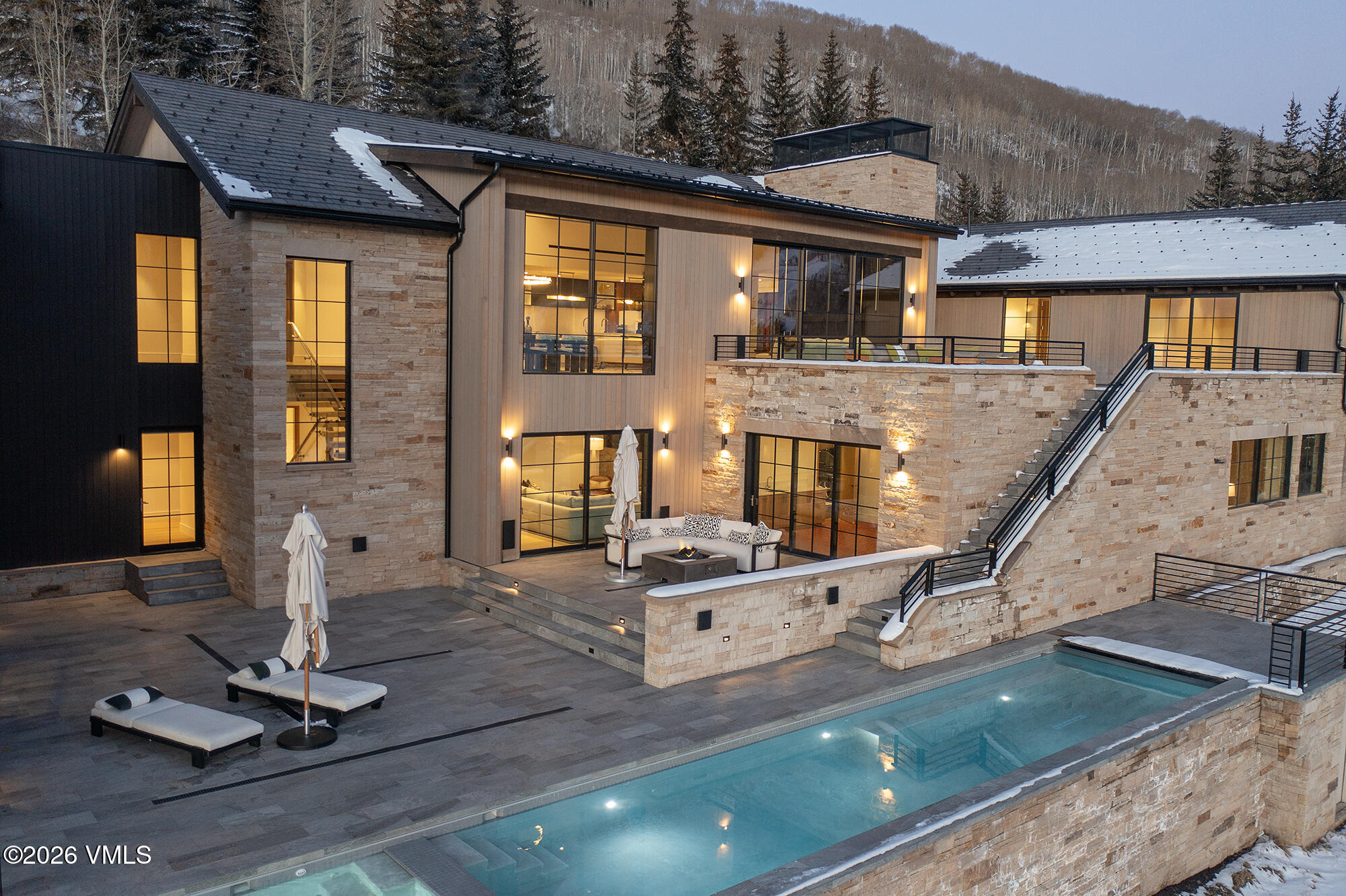 1326 Spraddle Creek Road Vail, CO 81657 - Photo 19 of 26 a front view of house with a garden