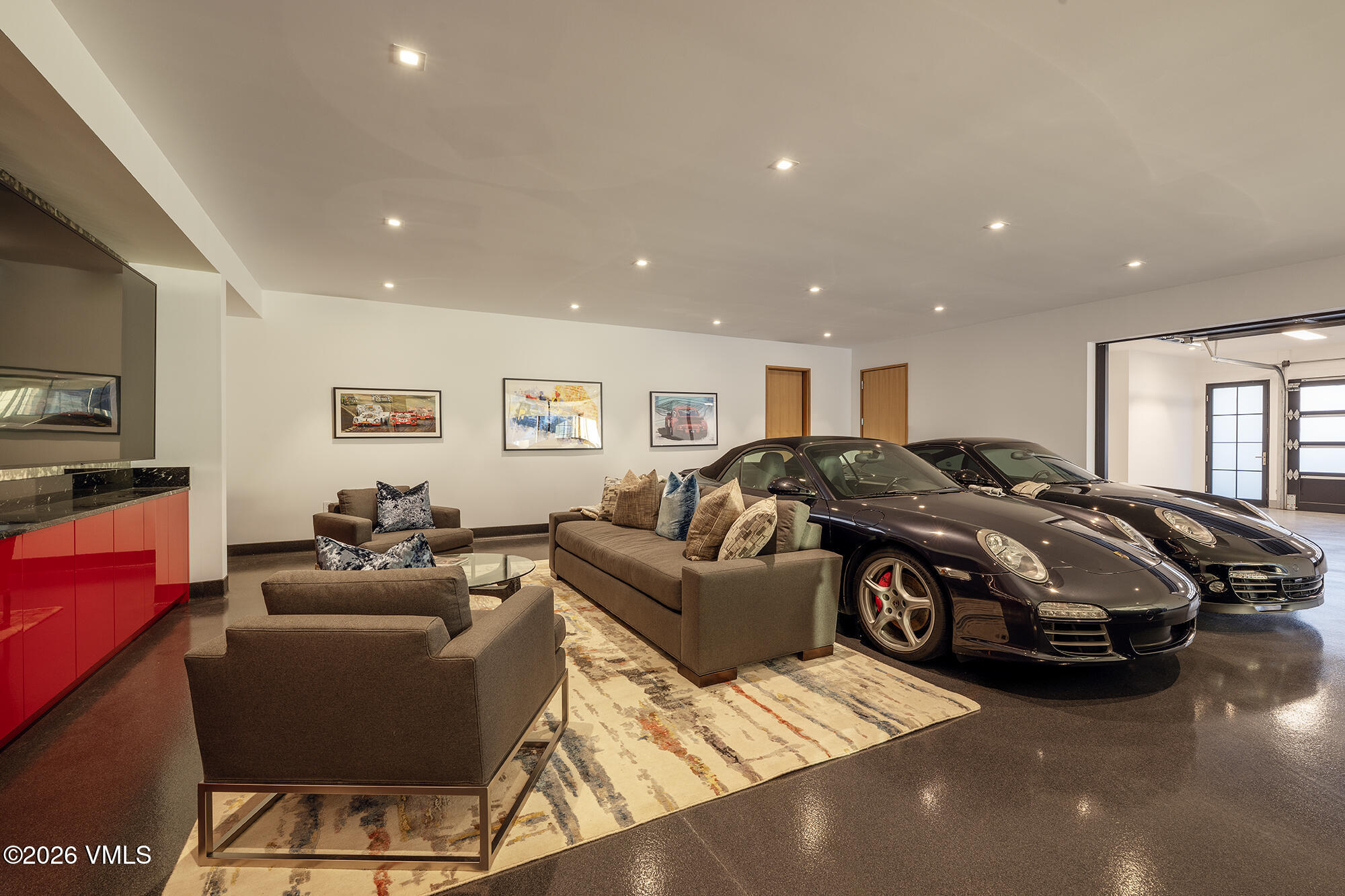 1326 Spraddle Creek Road Vail, CO 81657 - Photo 22 of 26 a living room with a couch and a flat screen tv