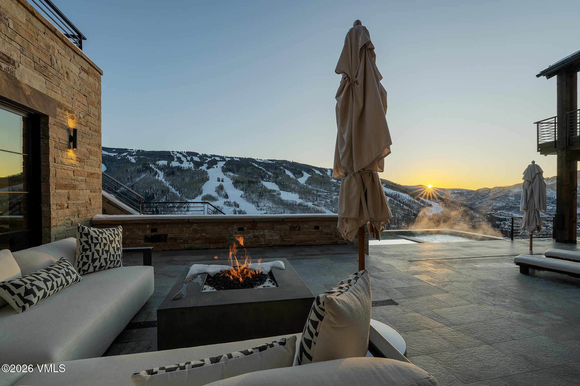 1326 Spraddle Creek Road Vail, CO 81657 - Photo 26 of 26 a living room with furniture and a fireplace