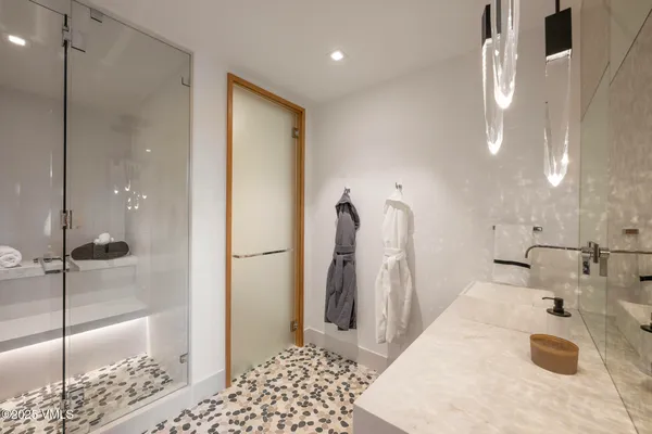 a bathroom with a sink and a shower