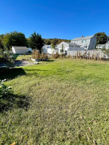 a view of lawn chairs and ocean view