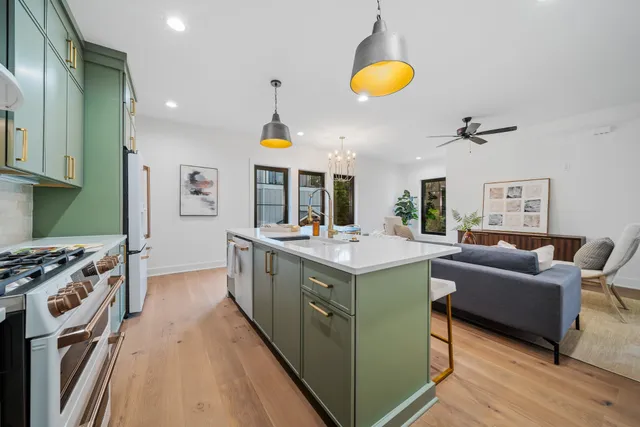 a kitchen with a sink and a stove top oven