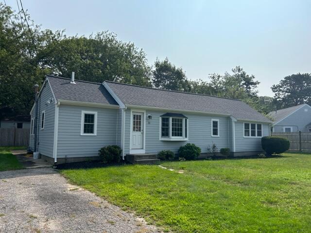 32 Fifth Avenue Hyannis, MA 02601 - Photo 1 of 11 a view of a yard in front of a house with plants and large tree