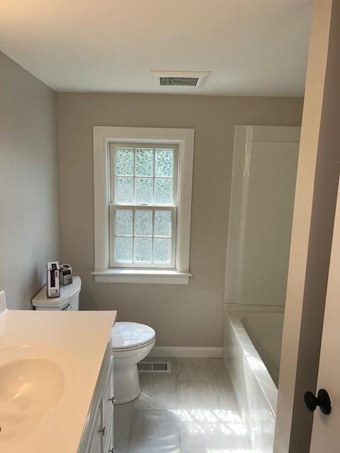 32 Fifth Avenue Hyannis, MA 02601 - Photo 5 of 11 a bathroom with a bathtub sink and toilet