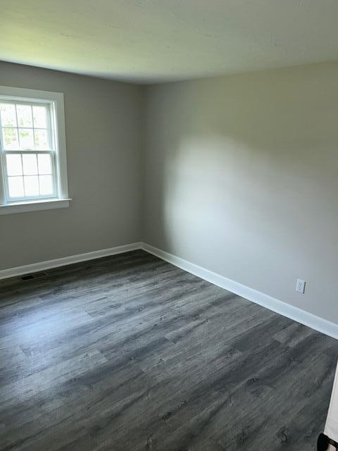 32 Fifth Avenue Hyannis, MA 02601 - Photo 7 of 11 an empty room with wooden floor and windows