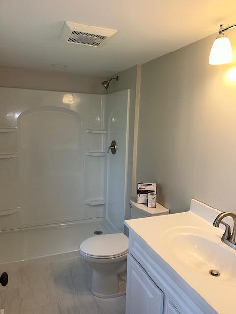 32 Fifth Avenue Hyannis, MA 02601 - Photo 9 of 11 a bathroom with a sink a toilet and shower