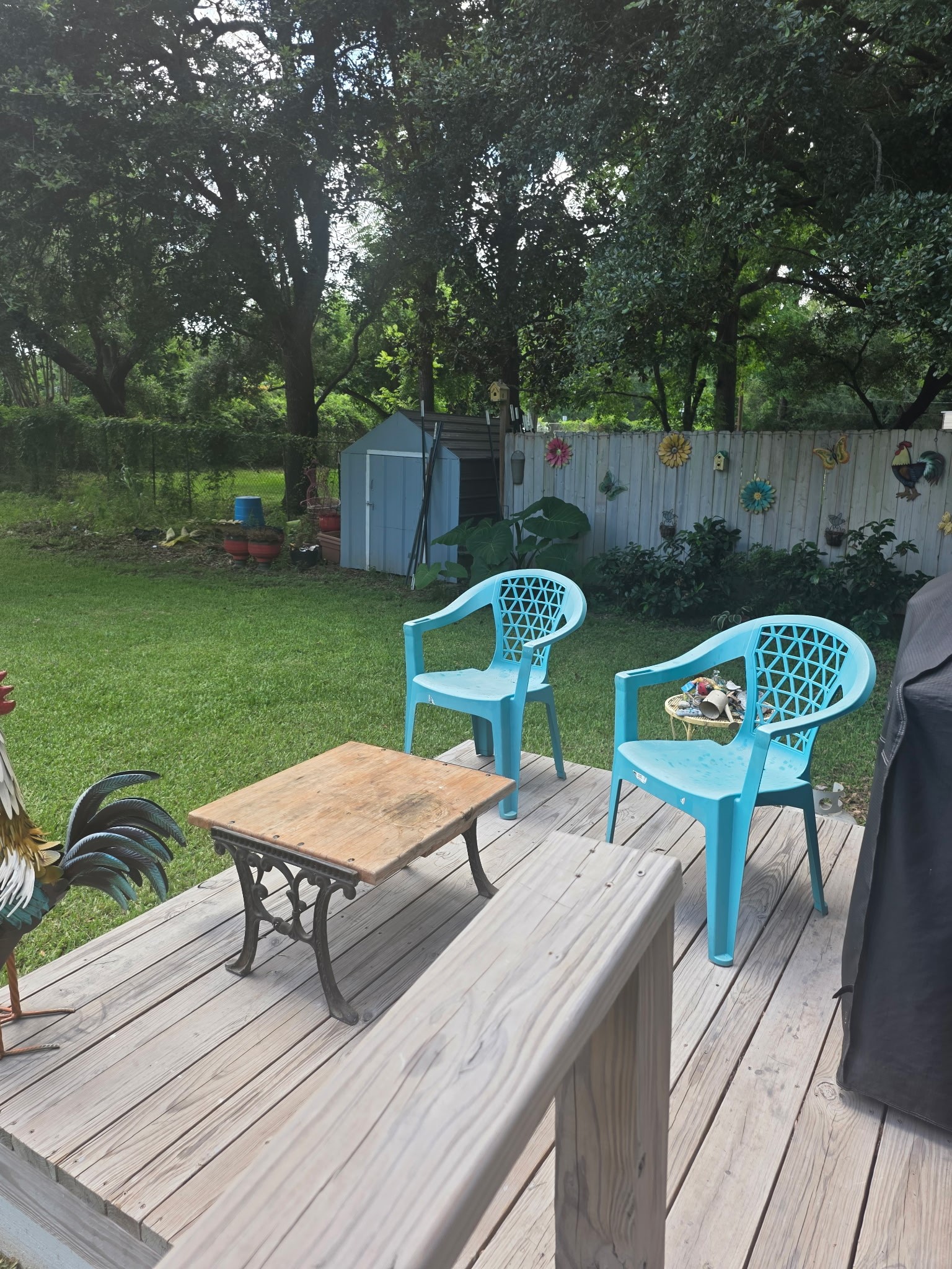 11 Pine Road Coldspring, TX 77331 - Photo 32 of 32 a view of a chairs and table on the deck with wooden floor