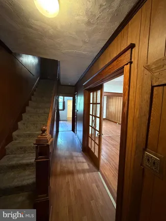 a view of gallery with wooden floor
