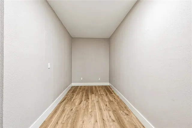a view of wooden floor in a bathroom