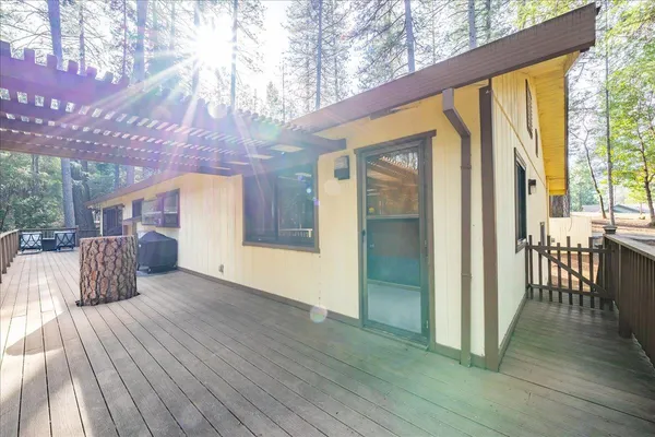 a view of a house with swimming pool and sitting area