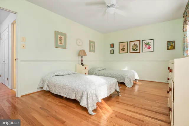 a bedroom with double bed and a window